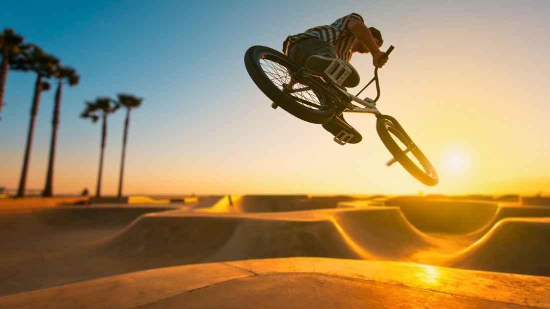 Person riding an e-bike on a skatepark, highlighting the adventure and versatility of electric bikes for outdoor enthusiasts